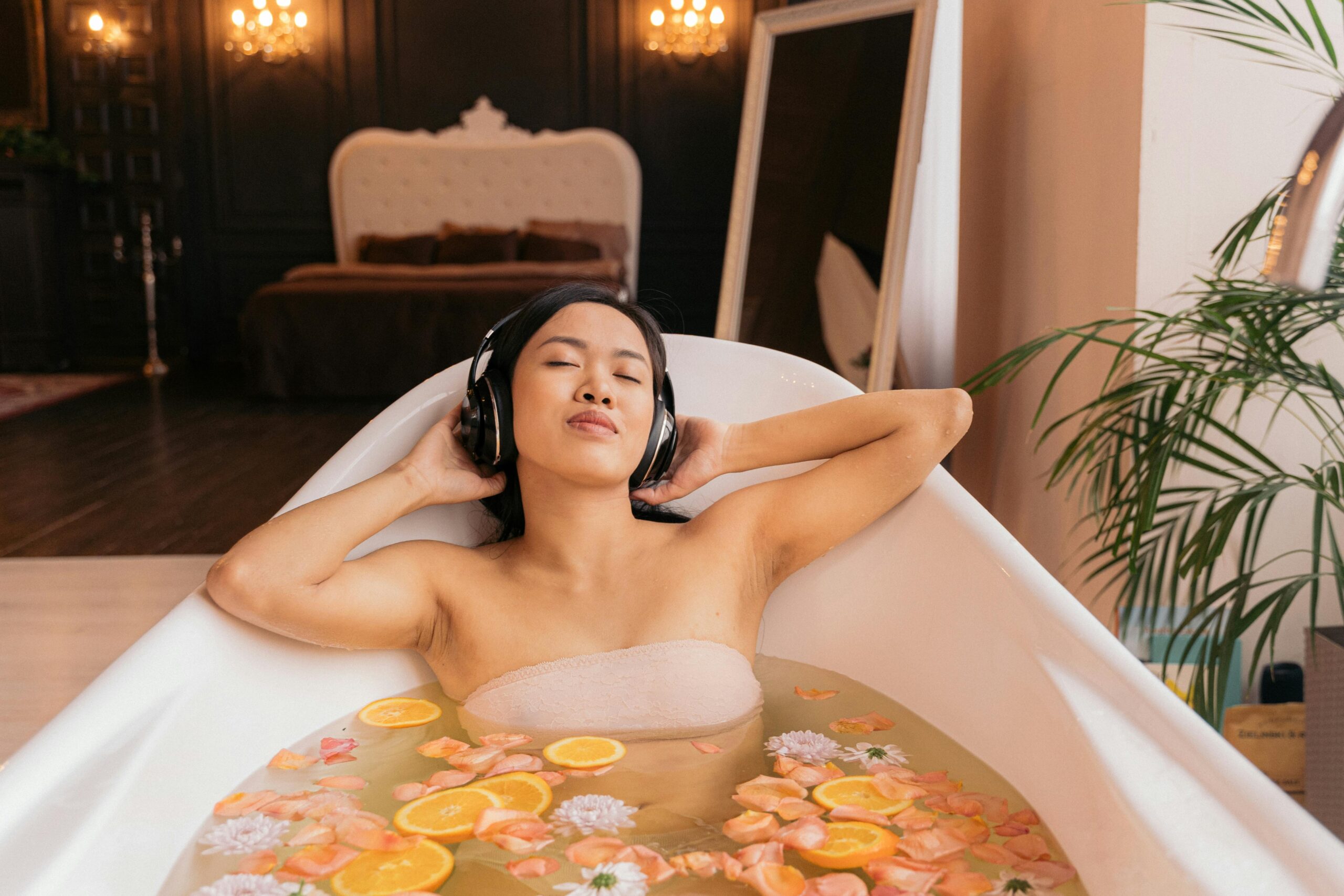 How to find the one - Woman unwinding in a bathtub filled with oranges, promoting a sense of calm and tranquility.