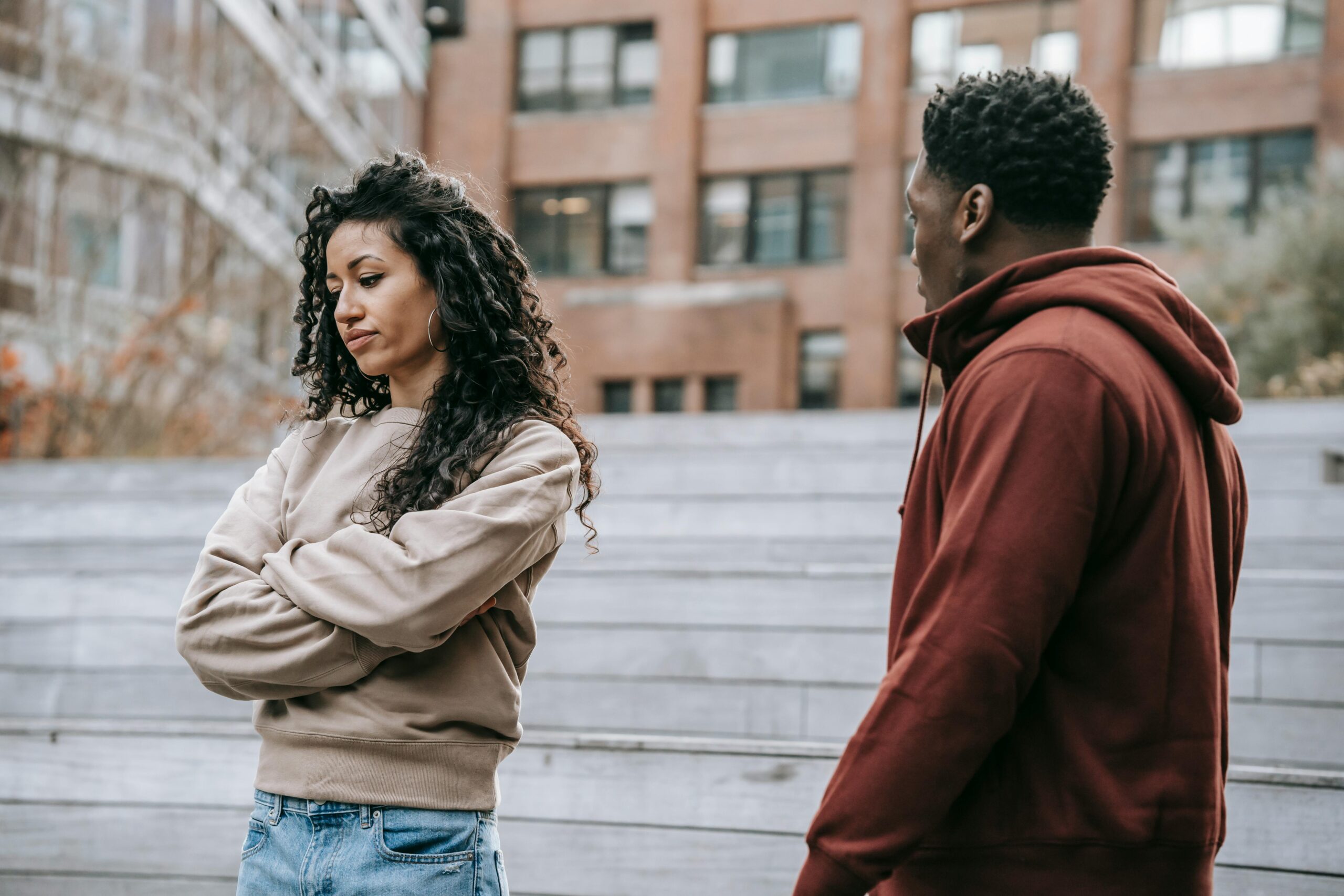 how to find the one - A woman is crossing her arms, clearly frustrated with her partner who stands next to her.