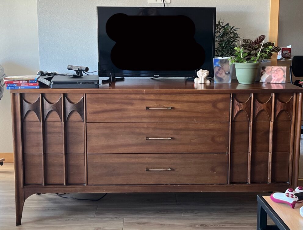 benefits of thrifting - Kent Coffey 9-drawer dresser with TV and decor on it.