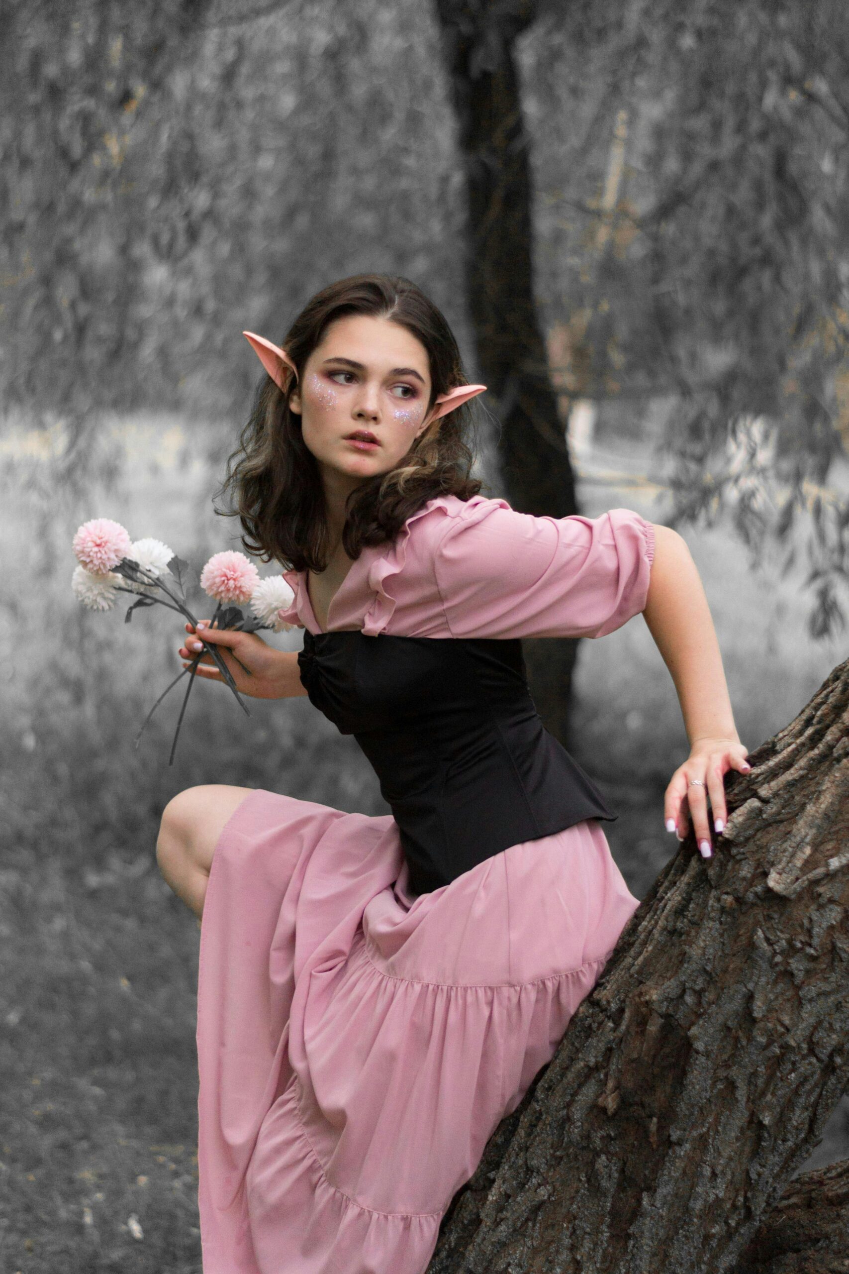 aesthetic quotes - A woman in a pink dress standing in a forest with elf ears on.