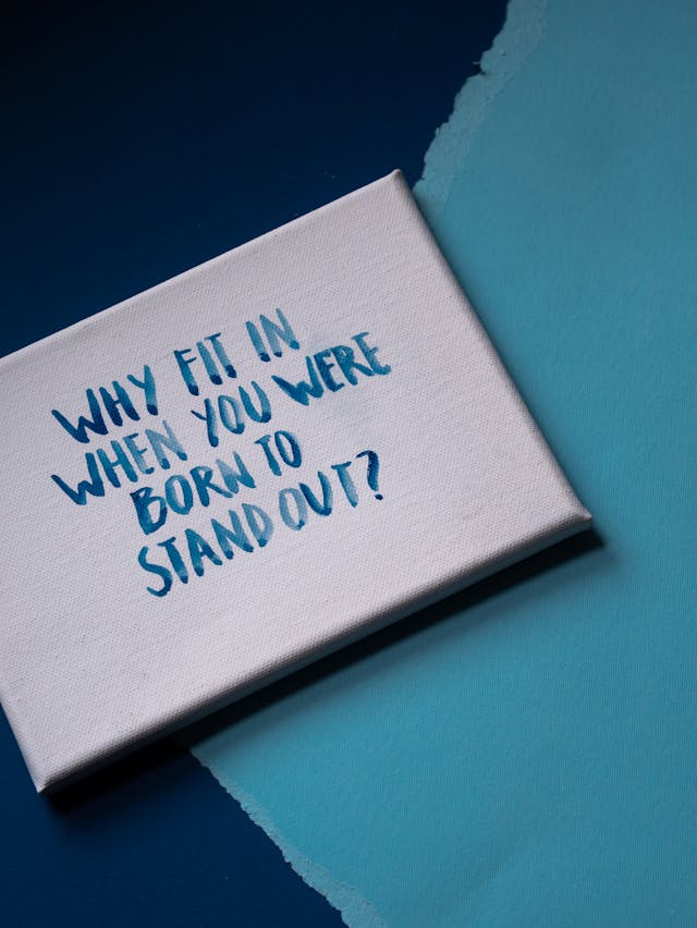 diagnosis journey - White canvas with blue watercolor text "Why fit in when you were born to stand out?"